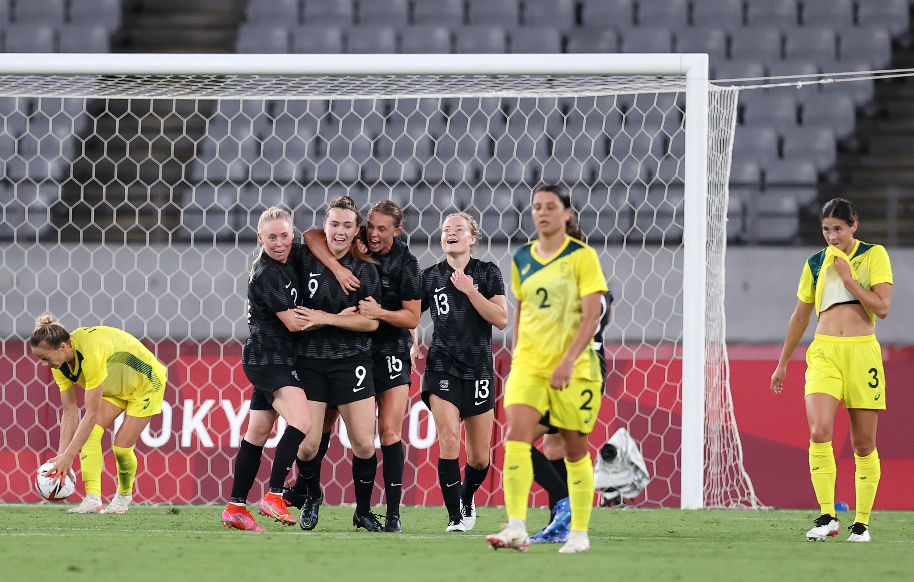 CHOFU, JAPAN - JULY 21: Gabi Rennie #9 of Team New Zealand celebrates with team mates after scoring their side's first goal during the Women's First Round Group G match between Australia and New Zealand during the Tokyo 2020 Olympic Games at Tokyo Stadium on July 21, 2021 in Chofu, Tokyo, Japan. (Photo by Alex Grimm - FIFA/FIFA via Getty Images)