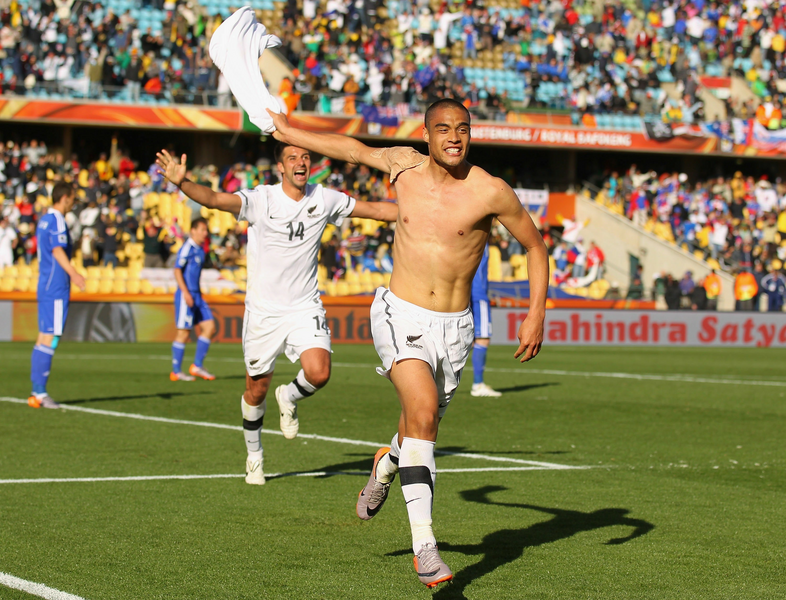 Winston Reid of New Zealand (#4) celebrates