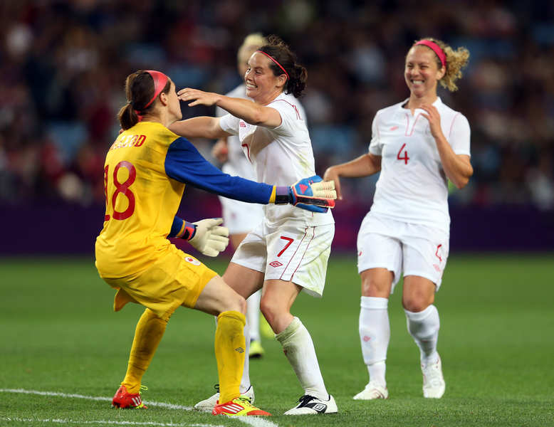 Rhian Wilkinson of Canada celebrates with Erin McLeod of Canada after the Women's Football Quarter Final match between Great Britain and Canada, on Day 7 of the London 2012 Olympic Games at City of Coventry Stadium on August 3, 2012 in Coventry, England.