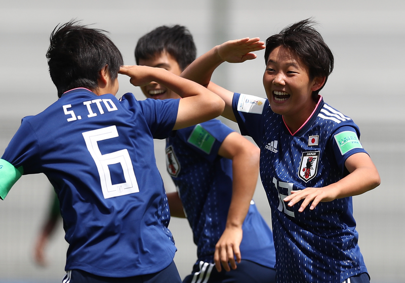 Haruka Osawa #12 celebrates a goal with Sara Ito #6 of Japan against South Africa 