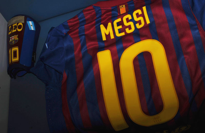 YOKOHAMA, JAPAN - DECEMBER 18:  The shirt and shin pad of Lionel Messi is laid out prior to the FIFA Club World Cup Final match between Santos and FC Barcelona at the International Yokohama Stadium on December 18, 2011 in Yokohama, Japan.  (Photo by Mike Hewitt - FIFA/FIFA via Getty Images)