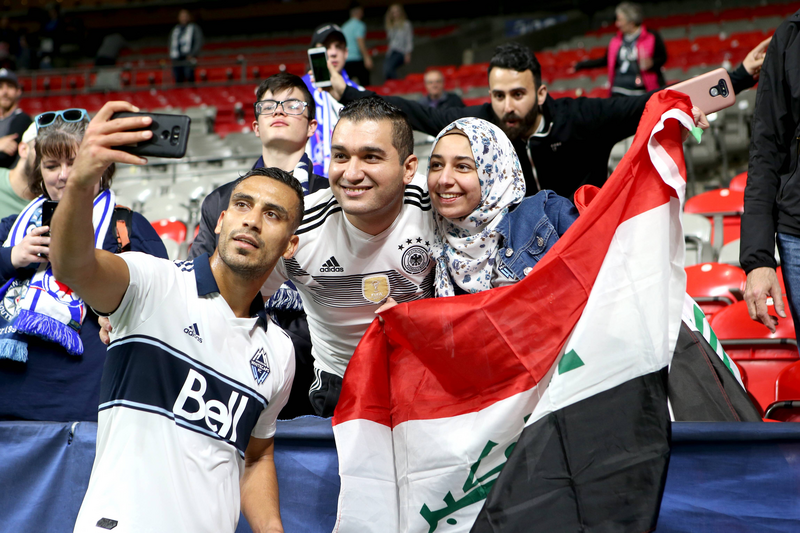 Vancouver Whitecaps defender Ali Adnan (53) poses for a selfie with Iraqi fans during their match at BC Place on May 15, 2019 in Vancouver, Canada. 