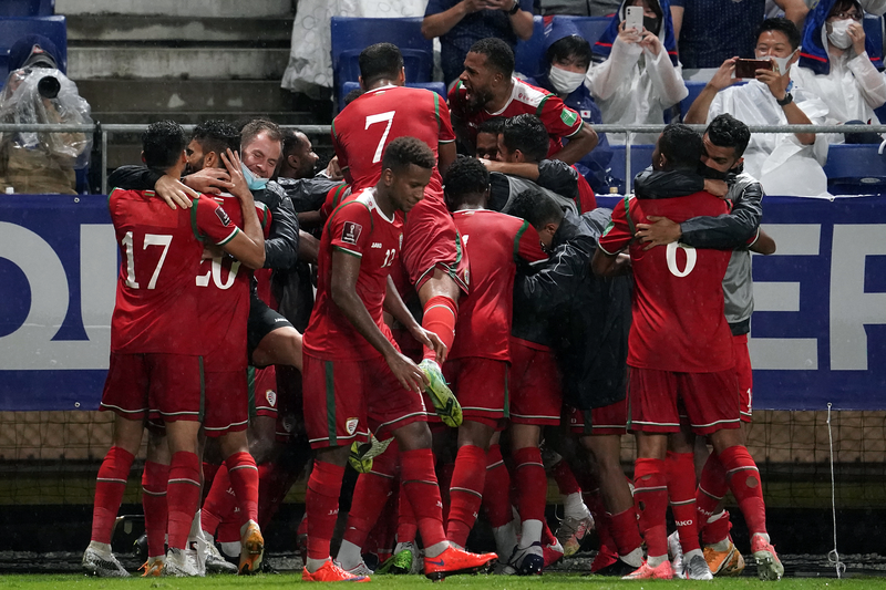 SUITA, JAPAN - SEPTEMBER 02: Issam Abdallah Al Sabhi #2 of Oman celebrates scoring his side's first goal with his team mate FIFA World Cup Asian Qualifier Final Round Group B match between Japan and Oman at Panasonic Stadium Suita on September 02, 2021 in Suita, Osaka, Japan. (Photo by Koji Watanabe/Getty Images)