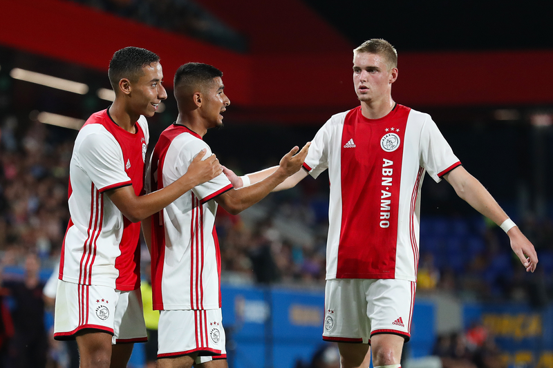 Naci Unuvar of Ajax U19 celebrates with his team mates Devyne Rensch (L) and Kenneth Taylor