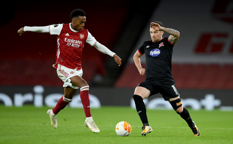 Patrick McEleney of Dundalk is challenged by Joe Willock of Arsenal