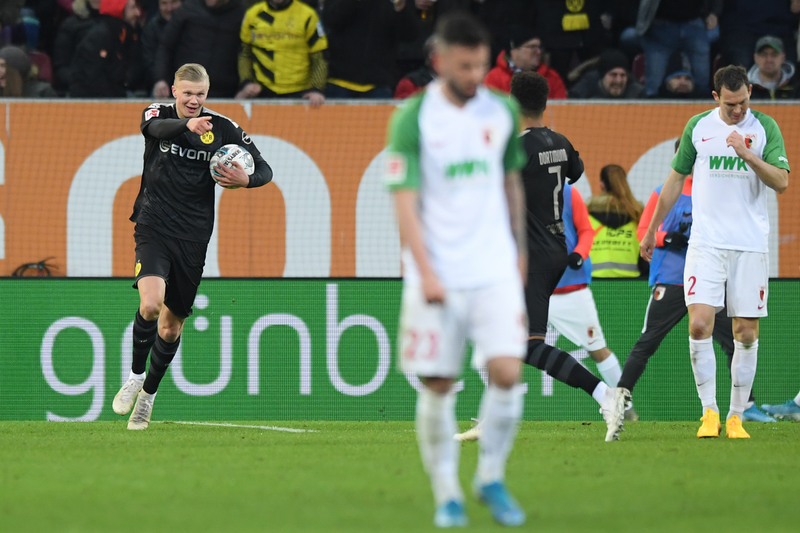 Erling Haaland of Borussia Dortmund celebrates after scoring his team's second goal during the Bundesliga match between FC Augsburg and Borussia Dortmund 