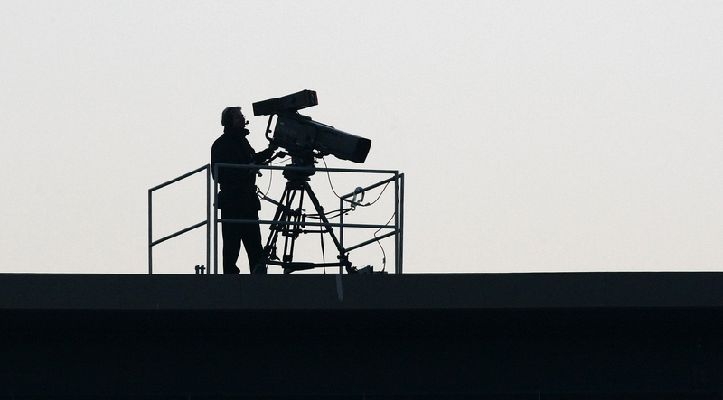 A TV camera at a football match 
