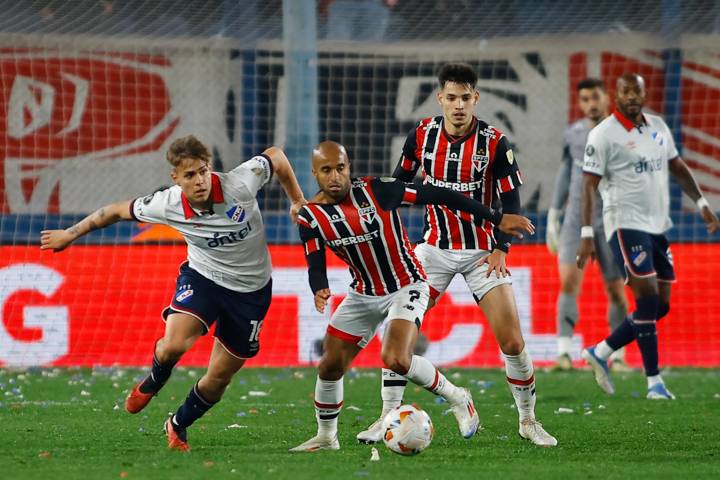 Jeremia Recoba of Nacional and Lucas Moura of Sao Paulo battle for the ball