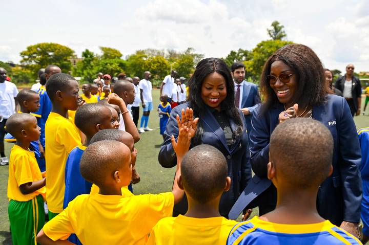 KIGALI, RWANDA - MARCH 14: FIFA Secretary General Fatma Samoura (L) and FIFA Football for Schools Director Fatimata Sidibe (R) with players during FIFA Football for Schools as part of the 73rd FIFA Congress at Gitagata Rehabilitation Center, Bugasera on March 14, 2023 in Kigali, Rwanda. (Photo by Brendan Moran - FIFA/FIFA via Sportsfile)