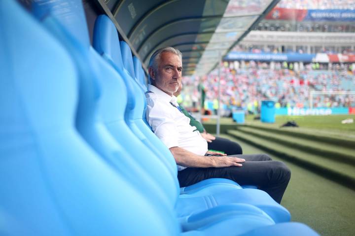 Bert van Marwijk sits in the dugout at the 2018 FIFA World Cup.