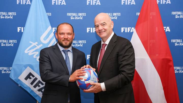 PARIS, FRANCE - JULY 31: FIFA President Gianni Infantino and Latvian Football Federation President Vadims Laenko pose with an Olympic Games Paris 2024 official match ball during a meeting between FIFA and the Latvian Football Federation at FIFA's Paris office on July 31, 2024 in Paris, France. (Photo by Léo-Paul Ridet/FIFA)