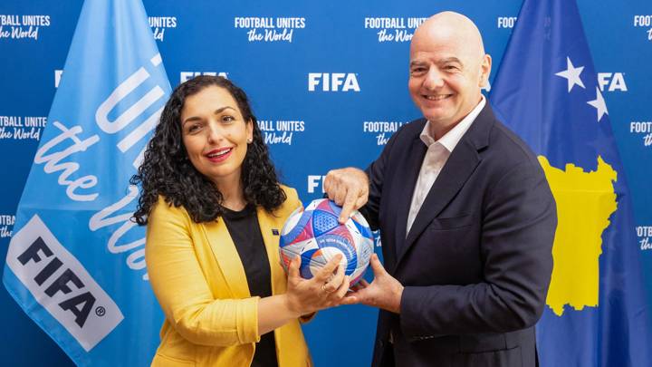 PARIS, FRANCE - JULY 29: FIFA President Gianni Infantino and President of the Republic of Kosovo Vjosa pose with an Olympic Games Paris 2024 official match ball during a meeting between FIFA and President of the Republic of Kosovo at FIFA's Paris office on July 29, 2024 in Paris, France. (Photo by Léo-Paul Ridet/FIFA)