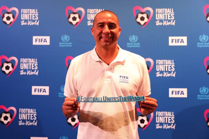 FIFA Legend David Trezeguet of France holds the Football Unites The World hashtag