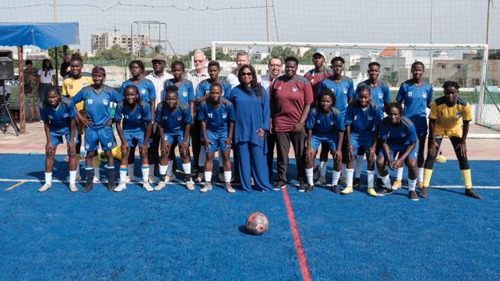 FIFA Secretary General, Fatma Samoura, stands for a group photo with an all girls football team and club representavies at the Dakar Sacre Couer football training grounds during the Sport Impact Summit in Dakar on 6 November, 2023. Dakar hosted the first edition of the Sport Impact Summit a reference event at the core of the sport industry in Africa.