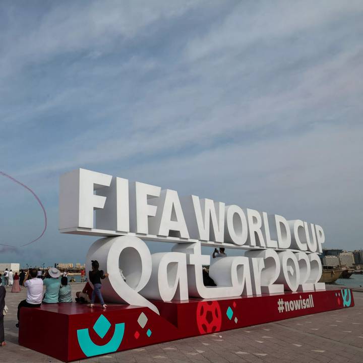 People watch an air show at the Corniche in Doha on November 5, 2022, ahead of the Qatar 2022 FIFA World Cup football tournament. (Photo by Giuseppe CACACE / AFP) (Photo by GIUSEPPE CACACE/AFP via Getty Images)