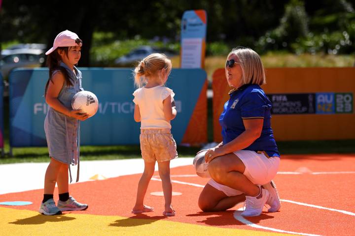 Young girls play football at a Unity Pitch in Hamilton.