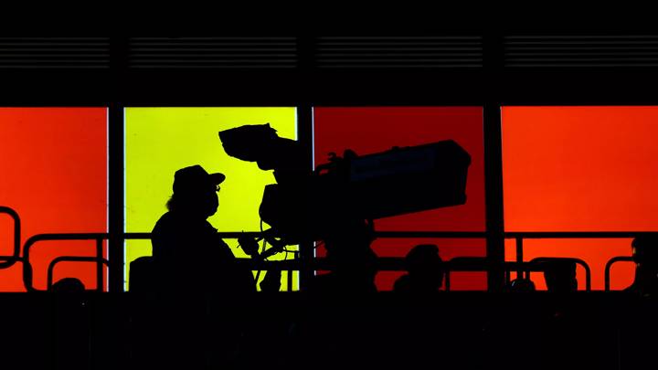 KAISERSLAUTERN, GERMANY - JULY 15: A TV camera is silhouetted during the Second Bundesliga match between 1. FC Kaiserslautern and Hannover 96 at Fritz-Walter-Stadion on July 15, 2022 in Kaiserslautern, Germany. (Photo by Alex Grimm/Getty Images)