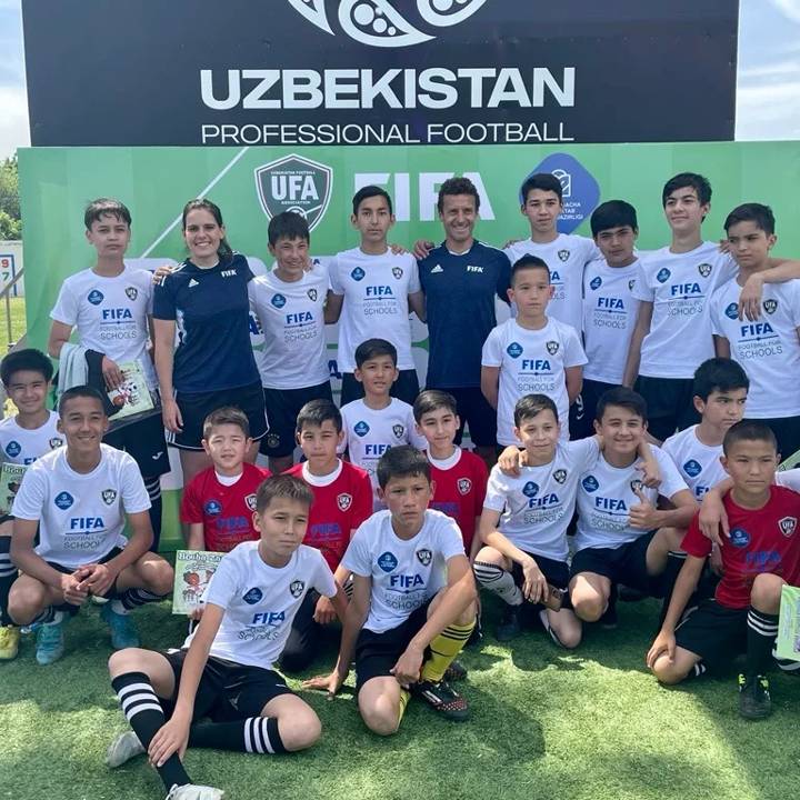 A group of children and the Football for School team after the event in Uzbekistan.