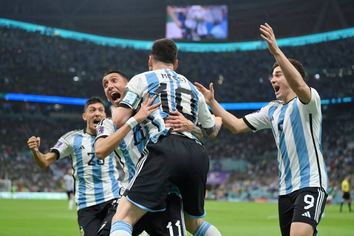 Lionel Messi (2nd R) of Argentina celebrates scoring their team's first goal 