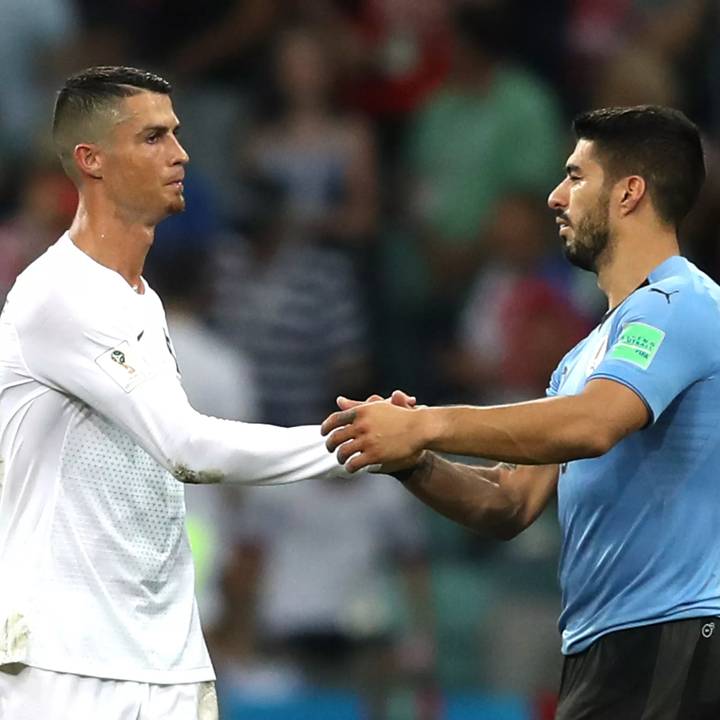 SOCHI, RUSSIA - JUNE 30: Luis Suarez of Uruguay shakes hands with Cristiano Ronaldo of Portugal following the 2018 FIFA World Cup Russia Round of 16 match between Uruguay and Portugal at Fisht Stadium on June 30, 2018 in Sochi, Russia. (Photo by Francois Nel/Getty Images)