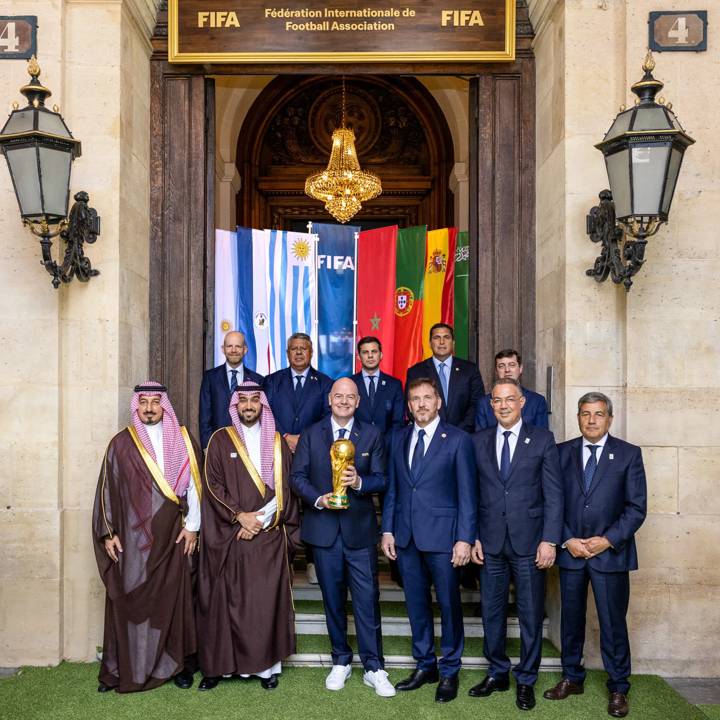 PARIS, FRANCE - JULY 29: (Back Row L-R) FIFA Secretary General Mattias Grafström, Argentine Football Association President Claudio Fabián Tapia, Royal Spanish Football Federation General Secretary Álvaro de Miguel Casanueva, Paraguayan Football Association President Robert Harrison, FIFA Council Member and President of the Uruguayan Football Association Ignacio Alonso, (Front Row L-R) FIFA Council Member and Saudi Arabian Football Federation President Yasser Al Misehal, Saudi Arabia Minster for Sport HRH Prince Abdulaziz bin Turki Al-Faisal, FIFA President Gianni Infantino, FIFA Vice-President and CONMEBOL President Alejandro Dominguez, FIFA Council Member and Royal Moroccan Football Federation President Fouzi Lekjaa and FIFA Council Member and Portugal Football Federation President Fernando Gomes pose for a group photo along with the FIFA World Cup Winner's Trophy during the FIFA World Cup 2030 and 2034 bid handover at FIFA's Paris office on July 29, 2024 in Paris, France. (Photo by Léo-Paul Ridet/FIFA)