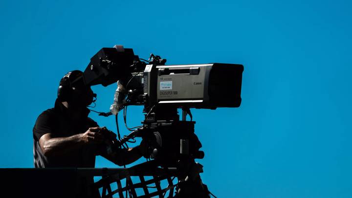 PERTH, AUSTRALIA - APRIL 30: (EDITORS NOTE: A polarizing filter was used for this image.) A TV camera operator is pictured during the Perth Supernight round of the 2022 Supercars Championship Season at Wanneroo Raceway on April 30, 2022 in Perth, Australia. (Photo by Daniel Kalisz/Getty Images)