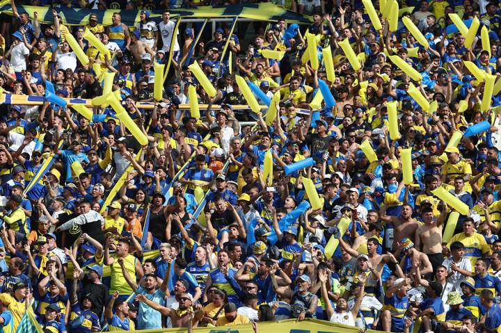 Supporters of Boca Juniors cheer for their team