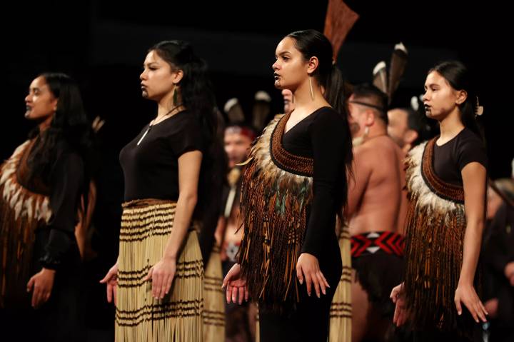 Performers perform a Powhiri 