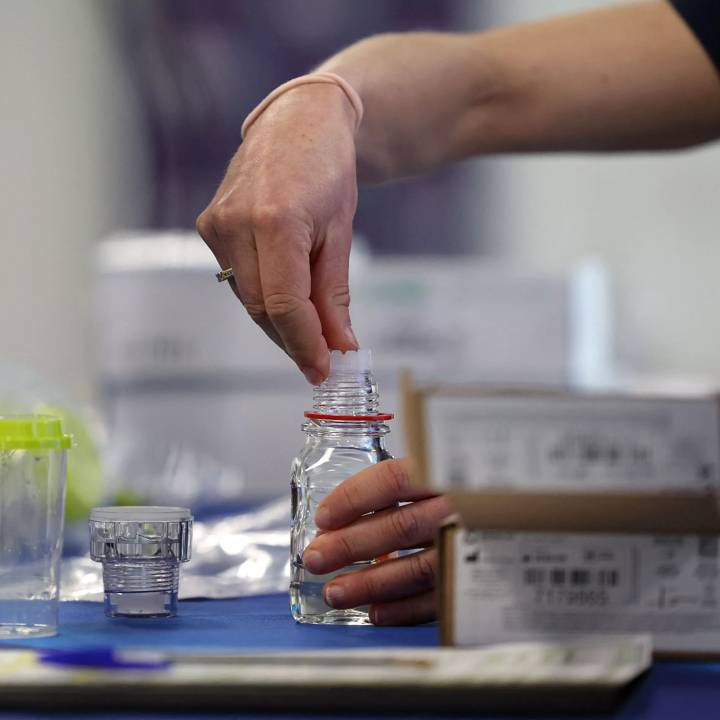 An attendee handles the sampling equipment during a training for doping controllers who came to train for the Paris Olympic and Paralympic Games in Saint-Denis, north of Paris, on April 22, 2023. - These 33 trainees responded this winter to a classified ad from the International Control Agency (ICA), which manages the Olympic anti-doping program on behalf of the International Olympic Committee (IOC). (Photo by FRANCK FIFE / AFP) (Photo by FRANCK FIFE/AFP via Getty Images)