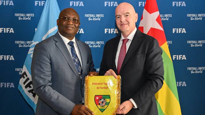 PARIS, FRANCE - AUGUST 07: FIFA President Gianni Infantino is presented with a Togo national team jersey by Togolese Football Federation President Kossi Guy Akpovy during a meeting between FIFA and the Togolese Football Federation President at FIFA's Paris office on August 07, 2024 in Paris, France. (Photo by Harold Cunningham/FIFA)