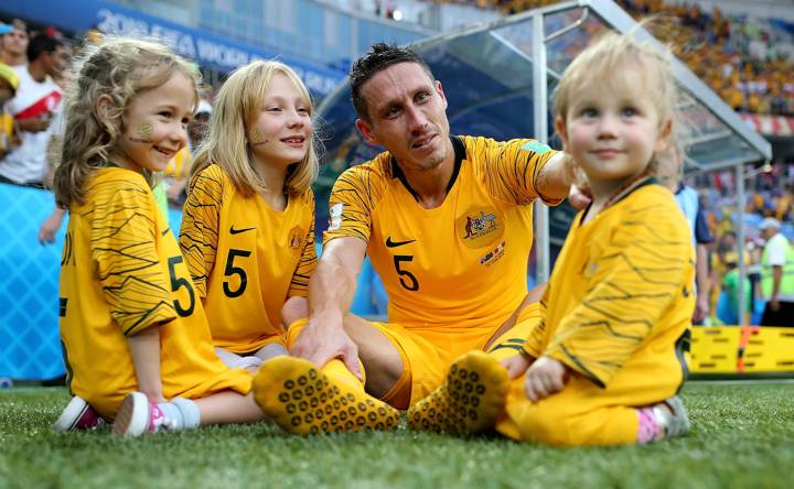 Mark Milligan of Australia speaks with his children after the 2018 FIFA World Cup Russia group C match between Australia and Peru at Fisht Stadium