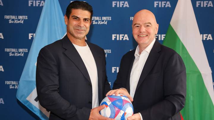 PARIS, FRANCE - AUGUST 1: FIFA President Gianni Infantino and Bulgarian Football Union President Georgi Ivanov pose with Olympic Games Paris 2024 official match ball during a meeting between FIFA and the Bulgarian Football Union at FIFA's Paris office on August 1, 2024 in Paris, France. (Photo by Alex Grimm- FIFA/FIFA via Getty Images)