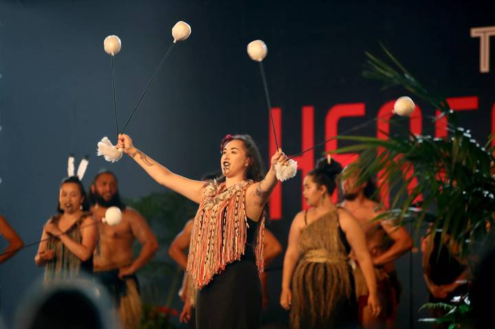 A Maori Kapa Haka group perform with poi during the Tamaki Herenga Waka Festival 