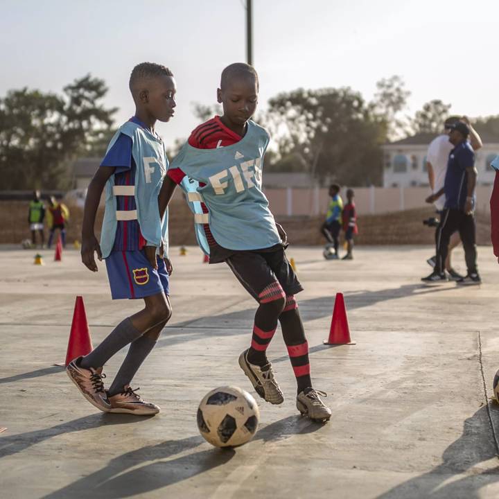 DAKAR, SENEGAL - JANUARY 18: Children play football during a FIFA Grassroots schools programme, on January 18, 2019 in Dakar, Senegal. (Photo by Maja Hitij - FIFA/FIFA via Getty Images)