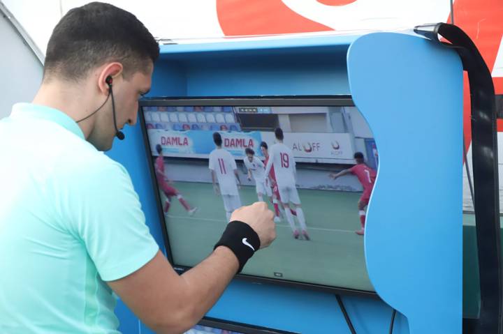 Referee checks a video screen as part of VAR training in Azerbaijan