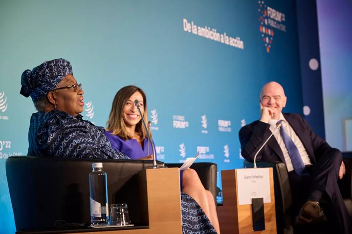 CNBC Reporter and Anchor Julianna Tatelbaum and FIFA President Gianni Infantino listen to World Trade Organization (WTO) Director-General Ngozi Okonjo-Iweala speak