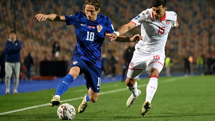 CAIRO, EGYPT - MARCH 23: Luka Modric of Croatia battles for possession with Oussama Haddadi of Tunisia during the FIFA Series 2024 Egypt match between Tunisia and Croatia at the Cairo International Stadium on March 23, 2024 in Cairo, Egypt. (Photo by Tullio Puglia - FIFA/FIFA via Getty Images)