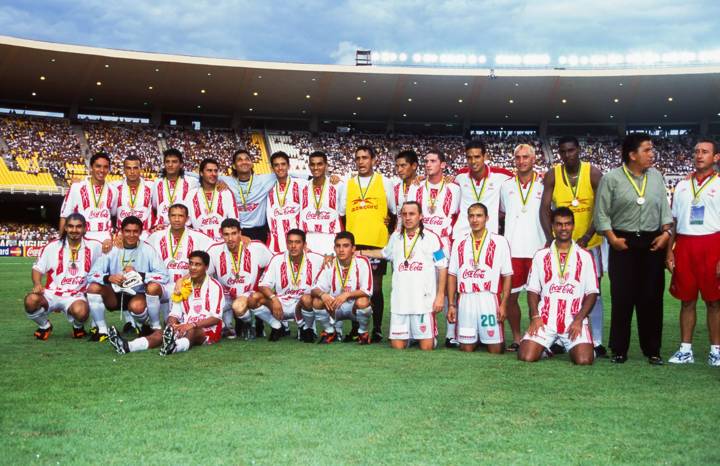 Necaxa players with their bronze medals at Brazil 2000