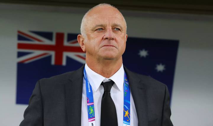 Graham Arnold, Manager of Australia looks on.