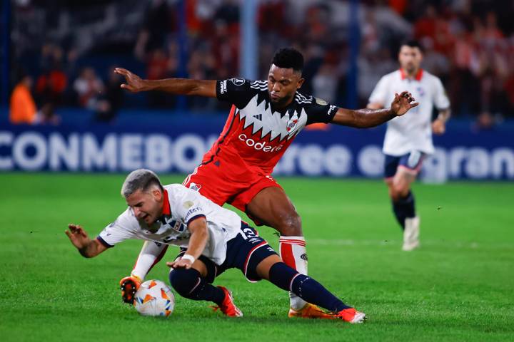 Miguel Borja of River Plate fights for the ball with Mateo Antoni, of Nacional