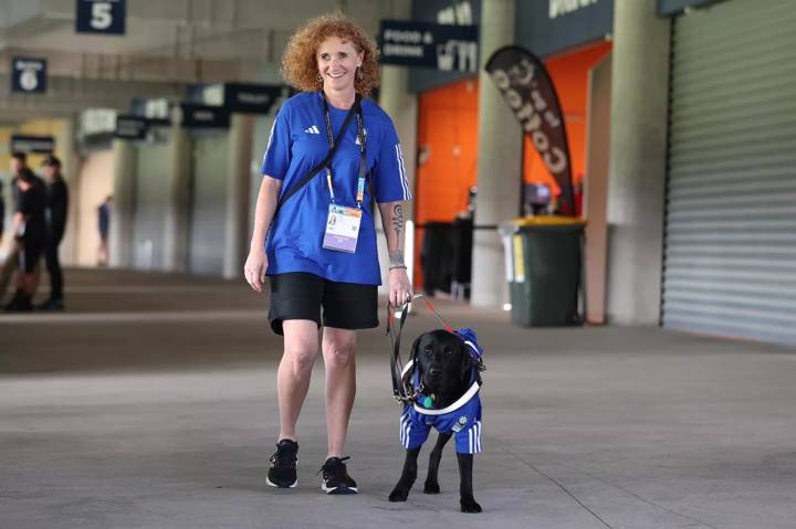 Volunteer Lisa Reid and her guide dog Romy