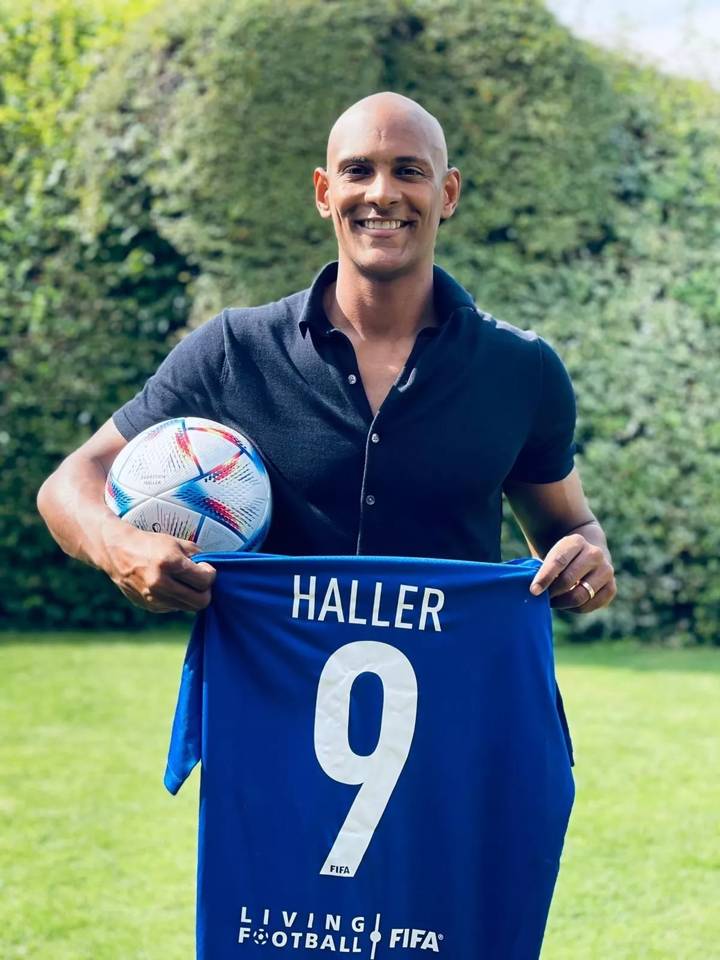  Sebastien Haller posing with a jersey and a ball