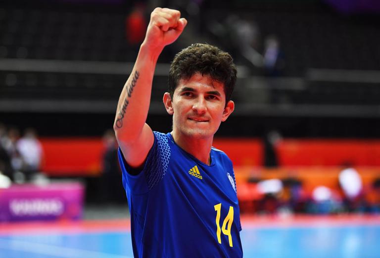 KAUNAS, LITHUANIA - SEPTEMBER 27: Douglas of Kazakhstan celebrates victory after the FIFA Futsal World Cup 2021 Quarter Final match between IR Iran and Kazakhstan at Kaunas Arena on September 27, 2021 in Kaunas, Lithuania. (Photo by Oliver Hardt - FIFA/FIFA via Getty Images)