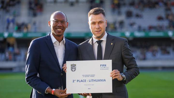 Kaunas, Lithuania - October 12: FIFA Chief Member Associations Officer Kenny Jean-Marie presents the FIFA Forward 2nd place award to Lithuanian Football Federation President Edgaras Stankevicius on October 12, 2024 in Kaunas, Lithuania. (Photo courtesy of LFF)