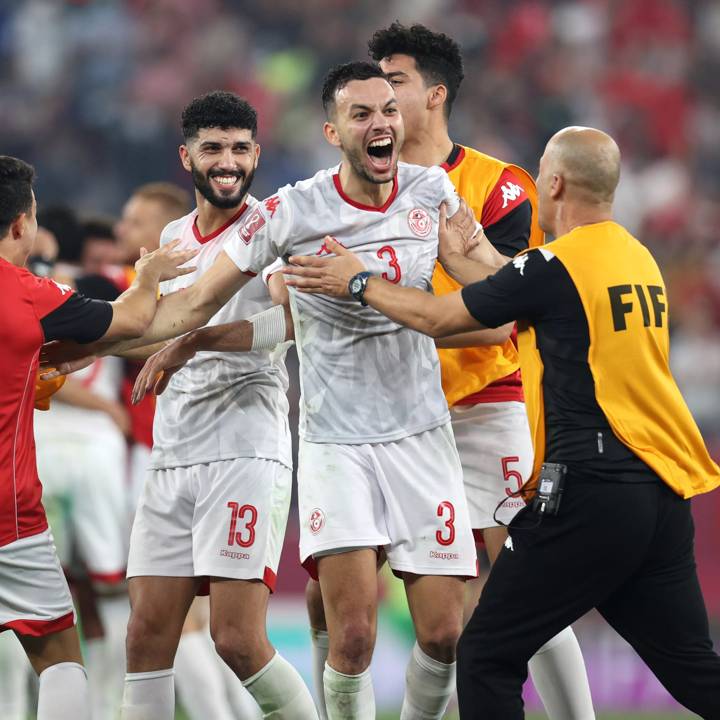 DOHA, QATAR - DECEMBER 15: Ferjani Sassi, Montassar Talbi and teammates of Tunisia celebrate following victory during the FIFA Arab Cup Qatar 2021 Semi-Final match between Tunisia and Egypt at Stadium 974 on December 15, 2021 in Doha, Qatar. (Photo by Maddie Meyer - FIFA/FIFA via Getty Images)