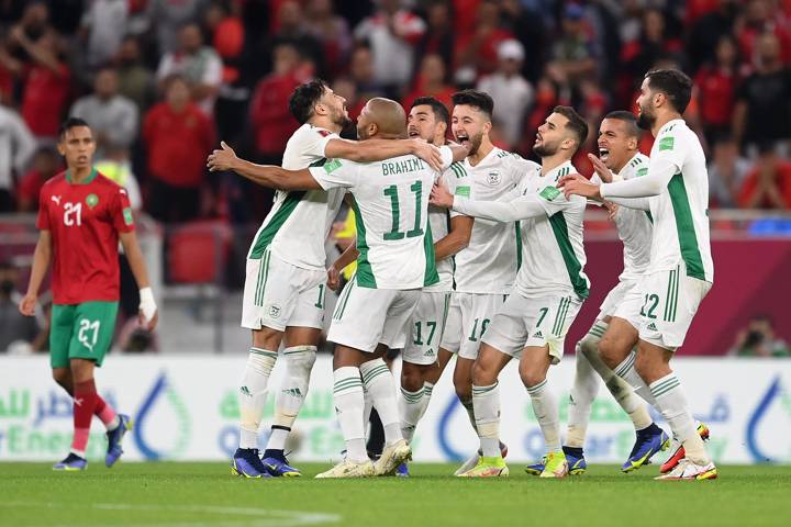 Yacine Brahimi of Algeria (obscured) celebrates with teammates.