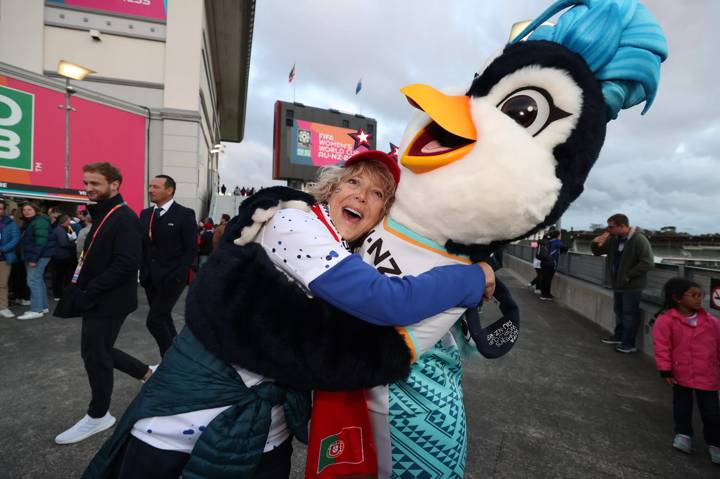 Rebecca Sheely, the '1 Millionth Fan through the gates', gets a hug from FIFA Women's World Cup Australia & New Zealand 2023 Official Mascot, Tazuni,