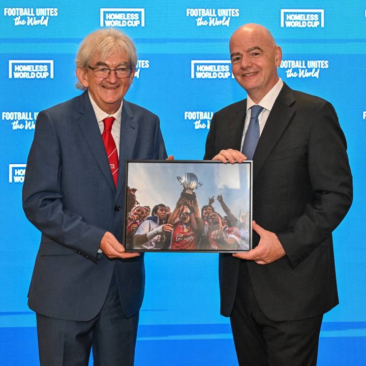 PARIS, FRANCE - AUGUST 02: FIFA President Gianni Infantino is presented with a photo by President and Founder of the Homeless World Cup Mel Young during Signing of the Memorandum of Understanding (MoU) between FIFA and Homeless World Cup Foundation at FIFA's Paris office on August 02, 2024 in Paris, France. (Photo by Harold Cunningham/FIFA)