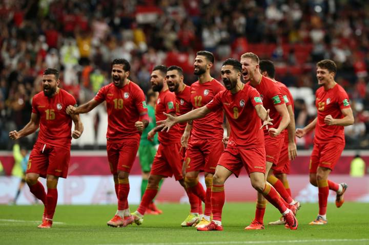 Mohammad Anez of Syria celebrates with teammates Mohammed Sahyouni, Moaiad Alkhouli, Oliver Kass Kawo, Mohammed Osman and Yousef Mohamma after scoring.