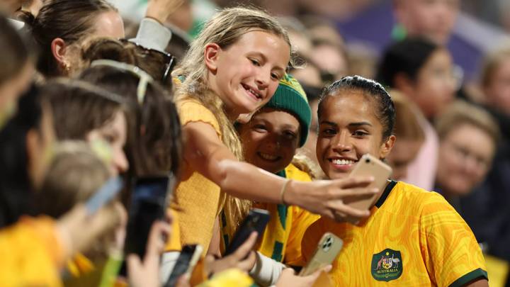 PERTH, AUSTRALIA - NOVEMBER 01: Mary Fowler of the Matildas poses for selfies with fans after the AFC Women's Asian Olympic Qualifier match between Australia and Chinese Taipei at HBF Park on November 1, 2023 in Perth, Australia. (Photo by Will Russell/Getty Images)